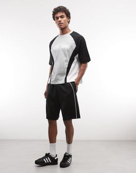 ASOS DESIGN ASOS DESIGN oversized jersey shorts with piping in scuba-style fabric in black