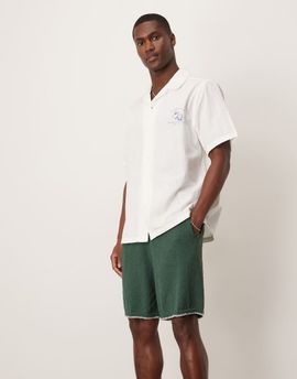 ASOS DESIGN ASOS DESIGN oversized knit shorts with blanket stitch in dark green