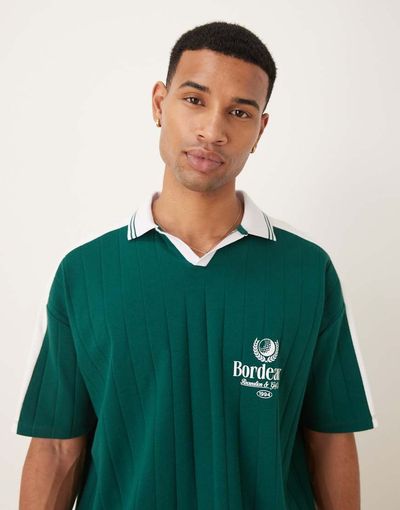 ASOS DESIGN ASOS DESIGN oversized polo with sports chest graphic in green-Multi