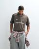 ASOS DESIGN ASOS DESIGN oversized sporty polo shirt with football high build graphic in brown - 1