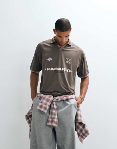 ASOS DESIGN ASOS DESIGN oversized sporty polo shirt with football high build graphic in brown