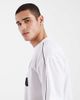 ASOS DESIGN ASOS DESIGN oversized T-shirt with paneled shoulders and soccer graphic in black and white sporty fabric - 4