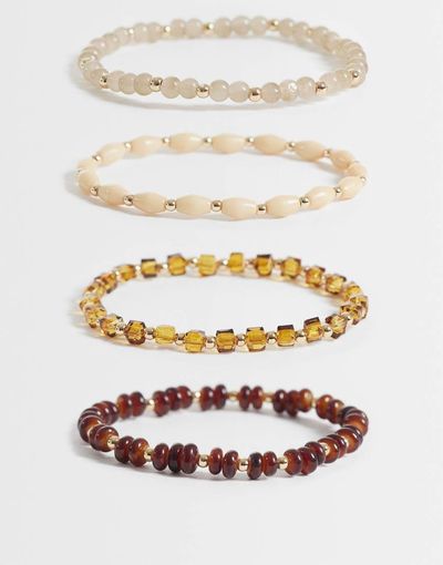 ASOS DESIGN ASOS DESIGN pack of 4 bracelets with mixed beads in amber tones-Silver