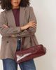 ASOS DESIGN ASOS DESIGN patent elongated shoulder bag in burgundy-Brown - 1