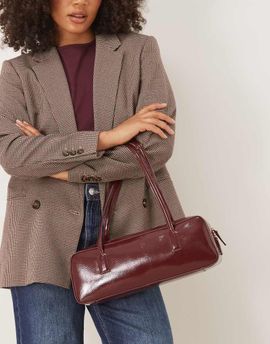 ASOS DESIGN ASOS DESIGN patent elongated shoulder bag in burgundy-Brown
