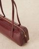 ASOS DESIGN ASOS DESIGN patent elongated shoulder bag in burgundy-Brown - 4