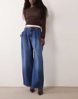 ASOS DESIGN ASOS DESIGN pleat front horseshoe jeans in mid authentic blue