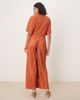 ASOS DESIGN ASOS DESIGN plisse plunge short sleeve wrap waist jumpsuit in rust-Orange - 4