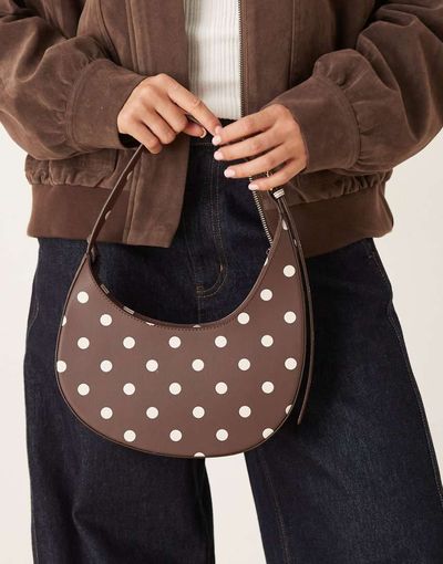 ASOS DESIGN ASOS DESIGN polka dot asymmetric scoop shoulder bag with buckle detail in chocolate-Brown
