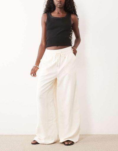 ASOS DESIGN ASOS DESIGN pull on waist wide leg cord pants in eggnog-Yellow