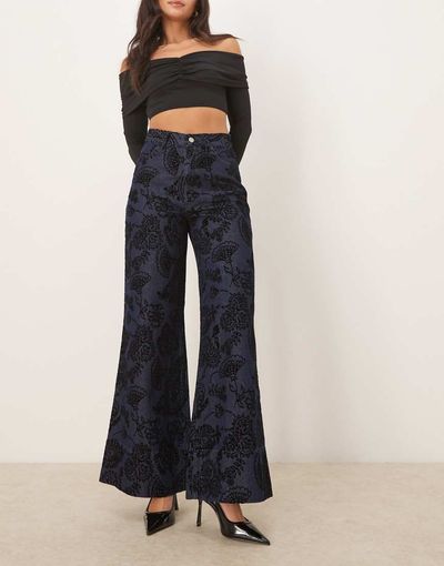 ASOS DESIGN ASOS DESIGN relaxed flare jeans with paisley flock in mid blue