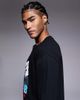 ASOS DESIGN ASOS DESIGN relaxed long sleeve T-shirt with ski sports graphic in black - 4