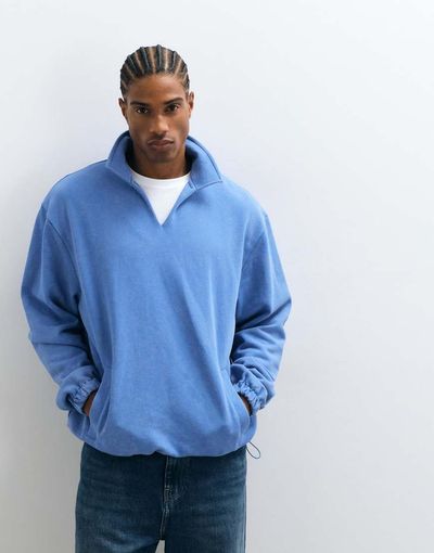 ASOS DESIGN ASOS DESIGN relaxed polo notch sweatshirt with cinch hem and acid wash in blue
