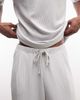ASOS DESIGN ASOS DESIGN relaxed tapered pleated plisse sweatpants in gray - 4