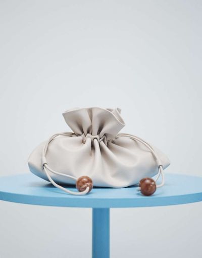 ASOS DESIGN ASOS DESIGN ruched resin ball pouch clutch bag with detachable shoulder strap in stone-Neutral