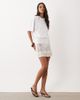 ASOS DESIGN ASOS DESIGN sheer crochet mini skirt with faux shell trim in white - 2