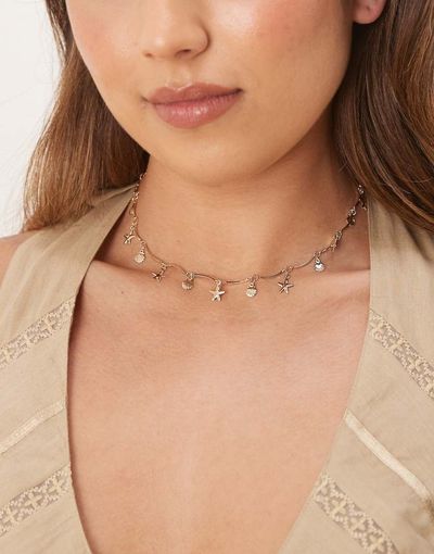 ASOS DESIGN ASOS DESIGN short necklace in wavy design with small sea-life charms in gold tone