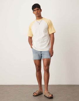 ASOS DESIGN ASOS DESIGN shorter length slim denim shorts with rip detail in light wash blue