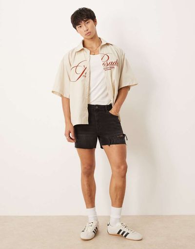 ASOS DESIGN ASOS DESIGN shorter length straight fit denim shorts with rip detail in black wash