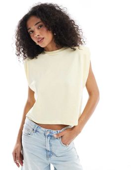 ASOS DESIGN ASOS DESIGN sleeveless shoulder pad top in buttermilk-Yellow