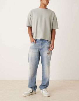 ASOS DESIGN ASOS DESIGN straight leg jeans in mid wash blue with rips