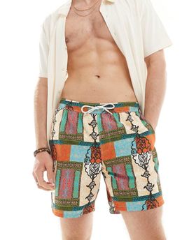 ASOS DESIGN ASOS DESIGN swim shorts in mid length in bright patchwork print-Red