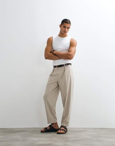 ASOS DESIGN ASOS DESIGN tailored pleated oversized tapered pants with rolled cuffs in ecru-Neutral