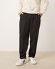 ASOS DESIGN ASOS DESIGN tailored pleated relaxed tapered pants with elastic waistband in black - 1