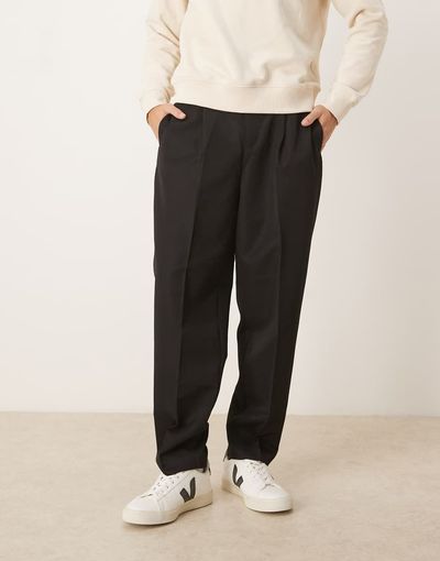 ASOS DESIGN ASOS DESIGN tailored pleated relaxed tapered pants with elastic waistband in black