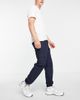 ASOS DESIGN ASOS DESIGN tapered cargo pants in navy with toggles - 4