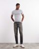ASOS DESIGN ASOS DESIGN tapered fit jeans with yellow tint in washed black - 1