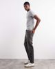 ASOS DESIGN ASOS DESIGN tapered fit jeans with yellow tint in washed black - 3
