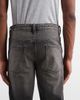 ASOS DESIGN ASOS DESIGN tapered fit jeans with yellow tint in washed black - 4