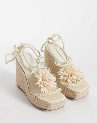 ASOS DESIGN ASOS DESIGN Topaz square toe wedge with flower trim in beige-Neutral