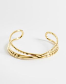 ASOS DESIGN ASOS DESIGN waterproof stainless steel cuff bracelet with cross-over design in gold tone