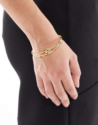 ASOS DESIGN ASOS DESIGN waterproof stainless steel cuff bracelet with infinity detail in gold tone with gift bag