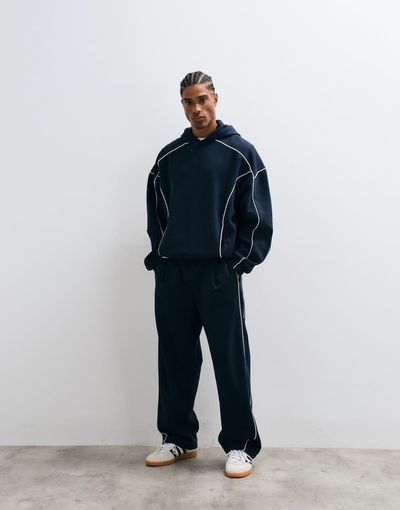 ASOS DESIGN ASOS DESIGN wide leg sweatpants with white piping in navy