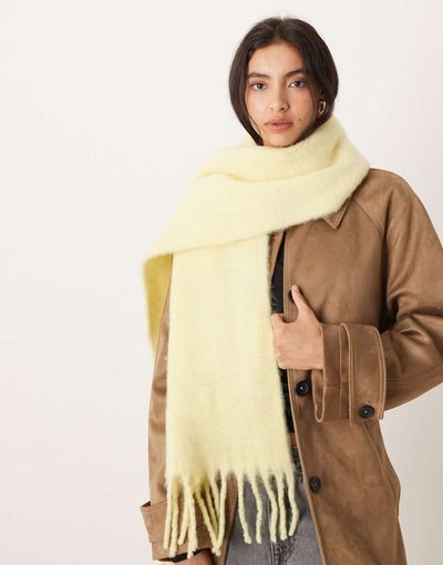 ASOS DESIGN ASOS DESIGN woven fluffy tassel scarf in buttermilk yellow