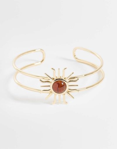ASOS DESIGN ASOS DESIGN wrap-around arm cuff with sun design in amber stone in gold tone