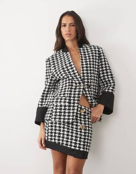 ASOS LUXE ASOS LUXE oversize dogtooth mini skirt with decorative buttons and contrast hem in mono-MULTI