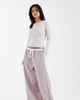 ASOS Petite ASOS DESIGN Petite crinkle tipped pull on pants with tie in pink stripe - 1