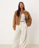 ASOS Petite ASOS DESIGN Petite cuffed hem wide leg corduroy pants in cream-White - 1