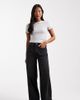 ASOS Petite ASOS DESIGN Petite high rise wide leg jeans with front pockets in black - 1