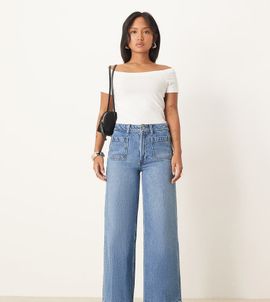 ASOS Petite ASOS DESIGN Petite high rise wide leg jeans with front pockets in mid blue
