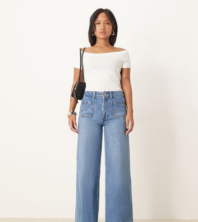 ASOS Petite ASOS DESIGN Petite high rise wide leg jeans with front pockets in mid blue
