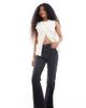ASOS Petite ASOS DESIGN Petite mid rise flare jeans in washed black - 1