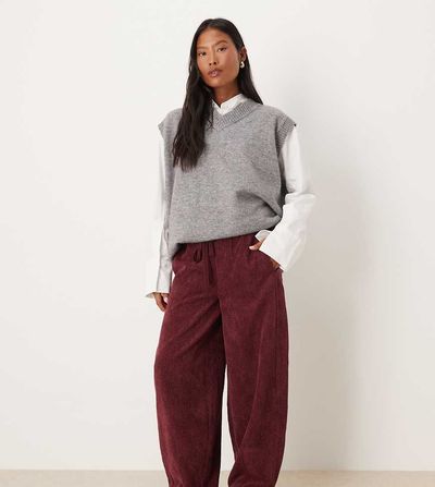 ASOS Petite ASOS DESIGN Petite pull on barrel leg corduroy pants in burgundy-Red