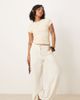 ASOS Petite ASOS DESIGN Petite relaxed straight leg pants with linen in off-white - 1
