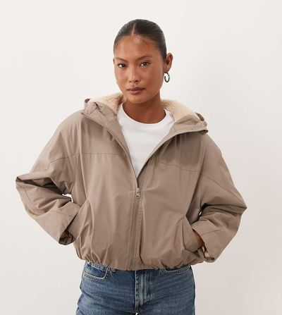 ASOS Petite ASOS DESIGN Petite short hooded rain coat with borg liner in neutral