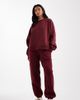 ASOS Petite ASOS DESIGN Petite ultimate cuffed brushback sweatpants in burgundy-Red - 1